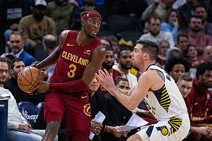 Mar 18, 2024; Indianapolis, Indiana, USA; Cleveland Cavaliers guard Caris LeVert (3) holds the ball while Indiana Pacers guard T.J. McConnell (9) defends in the first half at Gainbridge Fieldhouse. Mandatory Credit: Trevor Ruszkowski-USA TODAY Sports