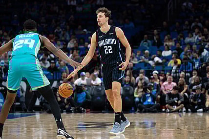 Mar 19, 2024; Orlando, Florida, USA; Orlando Magic forward Franz Wagner (22) dribbles the ball against Charlotte Hornets forward Brandon Miller (24) in the first quarter at KIA Center. Mandatory Credit: Jeremy Reper-USA TODAY Sports