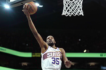 Mar 20, 2024; Phoenix, Arizona, USA; Phoenix Suns forward Kevin Durant (35) makes a layup against the Philadelphia 76ers during the first half at Footprint Center. Mandatory Credit: Joe Camporeale-USA TODAY Sports