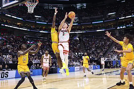 Mar 21, 2024; Salt Lake City, UT, USA;  Arizona Wildcats guard Pelle Larsson (3) drives to the net against  Long Beach State 49ers forward Amari Stroud (1) during the first half in the first round of the 2024 NCAA Tournament at Vivint Smart Home Arena-Delta Center. Mandatory Credit: Rob Gray-USA TODAY Sports