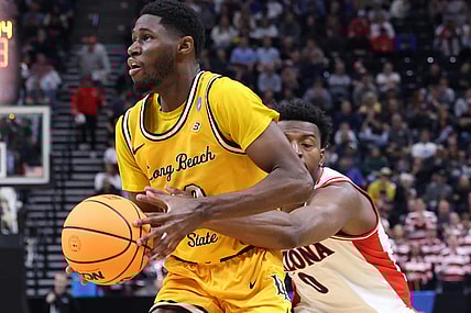 Mar 21, 2024; Salt Lake City, UT, USA; Long Beach State 49ers guard Jadon Jones (12) defended by Arizona Wildcats guard Jaden Bradley (0) during the second half in the first round of the 2024 NCAA Tournament at Vivint Smart Home Arena-Delta Center. Mandatory Credit: Rob Gray-USA TODAY Sports