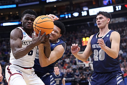 Mar 21, 2024; Salt Lake City, UT, USA; Dayton Flyers guard Enoch Cheeks (6) battles for the ball against  Nevada Wolf Pack forward Tylan Pope (33)during the first half in the first round of the 2024 NCAA Tournament at Vivint Smart Home Arena-Delta Center. Mandatory Credit: Rob Gray-USA TODAY Sports