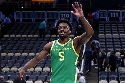 Mar 21, 2024; Pittsburgh, PA, USA; Oregon Ducks guard Jermaine Couisnard (5) waves as he walks off the court after the Oregon Ducks beat the South Carolina Gamecocks in the first round of the 2024 NCAA Tournament at PPG Paints Arena. Mandatory Credit: Charles LeClaire-USA TODAY Sports