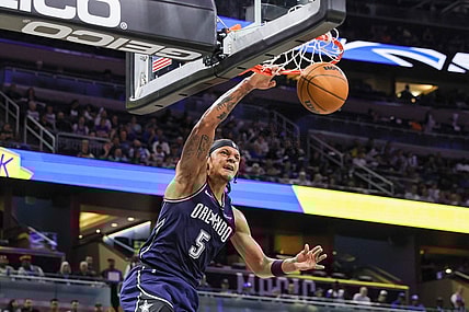 Mar 21, 2024; Orlando, Florida, USA; Orlando Magic forward Paolo Banchero (5) dunks during the second quarter against the New Orleans Pelicans at KIA Center. Mandatory Credit: Mike Watters-USA TODAY Sports