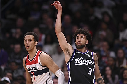 Mar 21, 2024; Washington, District of Columbia, USA;  Sacramento Kings guard Chris Duarte (3) follows through on a three point basket as Washington Wizards forward Patrick Baldwin Jr. (7) looks on during the first half at Capital One Arena. Mandatory Credit: Tommy Gilligan-USA TODAY Sports