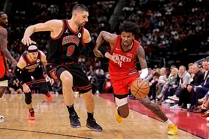 Mar 21, 2024; Houston, Texas, USA; Houston Rockets guard Jalen Green (4) handles the ball against Chicago Bulls center Nikola Vucevic (9) during the fourth quarter at Toyota Center. Mandatory Credit: Erik Williams-USA TODAY Sports
