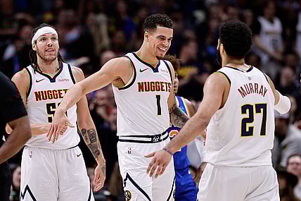 Mar 21, 2024; Denver, Colorado, USA; Denver Nuggets forward Michael Porter Jr. (1) reacts with guard Jamal Murray (27) ahead of forward Aaron Gordon (50) in the fourth quarter against the New York Knicks at Ball Arena. Mandatory Credit: Isaiah J. Downing-USA TODAY Sports