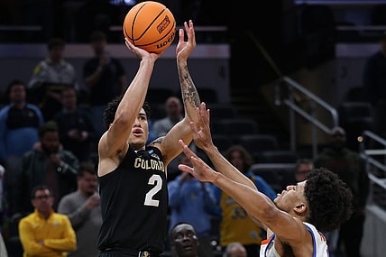 Mar 22, 2024; Indianapolis, IN, USA; Colorado Buffaloes guard KJ Simpson (2) shoots against Florida Gators guard Zyon Pullin (0) in the second half in the first round of the 2024 NCAA Tournament at Gainbridge FieldHouse. Mandatory Credit: Trevor Ruszkowski-USA TODAY Sports
