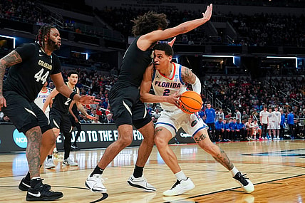 Florida Gators guard Riley Kugel (2) drives the lane against the Colorado Buffaloes on Friday, March 22, 2024, during the first round of the NCAA Men’s Basketball Tournament at Gainbridge Fieldhouse in Indianapolis. Florida Gators and Colorado Buffaloes are tied 45-45 at halftime.