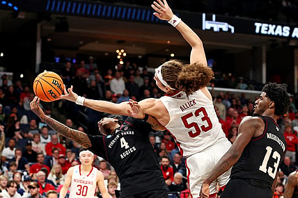 Mar 22, 2024; Memphis, TN, USA;  Texas A&M Aggies guard Wade Taylor IV (4) and Nebraska Cornhuskers forward Josiah Allick (53) go for the ball during the second half in the first round of the 2024 NCAA Tournament at FedExForum. Mandatory Credit: Petre Thomas-USA TODAY Sports