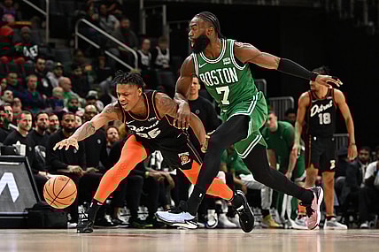 Mar 22, 2024; Detroit, Michigan, USA; Detroit Pistons guard Marcus Sasser (25) loses control of his dribble while being defended by Boston Celtics guard Jaylen Brown (7) in the third quarter at Little Caesars Arena. Mandatory Credit: Lon Horwedel-USA TODAY Sports