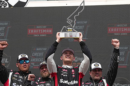 Corey Heim (11) holds up the trophy after wining the NASCAR Craftsman Truck Series Xpel 225 at the Circuit of the Americas on Saturday, March 23, 2024 in Austin.