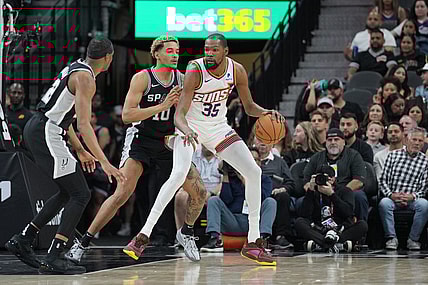 Mar 23, 2024; San Antonio, Texas, USA;  Phoenix Suns forward Kevin Durant (35) backs in against San Antonio Spurs forward Jeremy Sochan (10) in the first half at Frost Bank Center. Mandatory Credit: Daniel Dunn-USA TODAY Sports