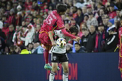 Mar 23, 2024; St. Louis, Missouri, USA; St. Louis CITY SC defender Anthony Markanich (13) challenges D.C. United midfielder Jared Stroud (8) for the ball during the second half at CITYPARK. Mandatory Credit: Scott Rovak-USA TODAY Sports