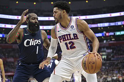 Mar 24, 2024; Los Angeles, California, USA;   Philadelphia 76ers forward Tobias Harris (12) is defended by Los Angeles Clippers guard James Harden (1) in the second half at Crypto.com Arena. Mandatory Credit: Jayne Kamin-Oncea-USA TODAY Sports