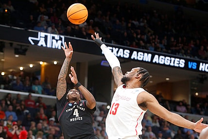 Texas A&M's Wade Taylor IV (4) shoots the ball during the second round game between Texas A&M and the University of Houston in the 2024 NCAA Tournament at FedExForum in Memphis, Tenn., on Sunday, March 24, 2024.