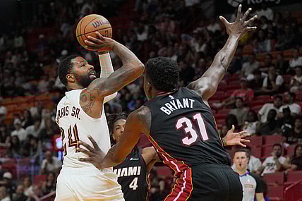 Mar 24, 2024; Miami, Florida, USA;  Cleveland Cavaliers forward Marcus Morris Sr. (24) takes a shot over Miami Heat center Thomas Bryant (31) during the second half at Kaseya Center. Mandatory Credit: Jim Rassol-USA TODAY Sports