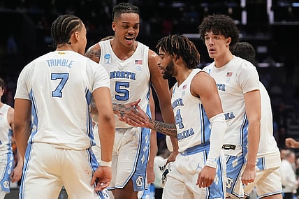 Mar 23, 2024; Charlotte, NC, USA;  North Carolina Tar Heels forward Armando Bacot (5) congratulates guard RJ Davis (4) after hitting a three point shot against Michigan State Spartans at Spectrum Center. Mandatory Credit: Jim Dedmon-USA TODAY Sports