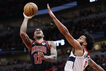 Mar 25, 2024; Chicago, Illinois, USA; Chicago Bulls forward DeMar DeRozan (11) goes to the basket against Washington Wizards forward Justin Champagnie (99) during the first half at United Center. Mandatory Credit: Kamil Krzaczynski-USA TODAY Sports