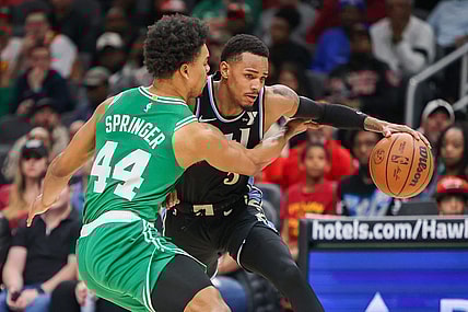 Mar 25, 2024; Atlanta, Georgia, USA; Boston Celtics guard Jaden Springer (44) defends Atlanta Hawks guard Dejounte Murray (5) in the second half at State Farm Arena. Mandatory Credit: Brett Davis-USA TODAY Sports