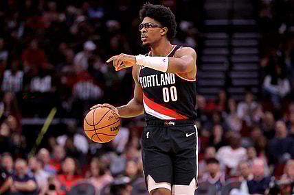 Mar 25, 2024; Houston, Texas, USA; Portland Trail Blazers guard Scoot Henderson (00) handles the ball against the Houston Rockets during the fourth quarter at Toyota Center. Mandatory Credit: Erik Williams-USA TODAY Sports