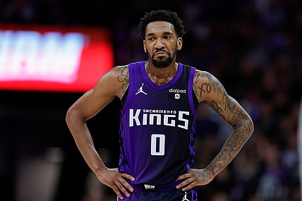 Mar 26, 2024; Sacramento, California, USA; Sacramento Kings guard Malik Monk (0) looks on during the fourth quarter against the Dallas Mavericks at Golden 1 Center. Mandatory Credit: Sergio Estrada-USA TODAY Sports