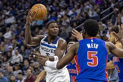 Mar 27, 2024; Minneapolis, Minnesota, USA; Minnesota Timberwolves guard Anthony Edwards (5) drives towards the basket and passes the ball against the Detroit Pistons in the first half at Target Center. Mandatory Credit: Jesse Johnson-USA TODAY Sports