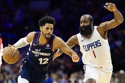 Mar 27, 2024; Philadelphia, Pennsylvania, USA; Philadelphia 76ers forward Tobias Harris (12) dribbles the ball against LA Clippers guard James Harden (1) during the second quarter at Wells Fargo Center. Mandatory Credit: Bill Streicher-USA TODAY Sports