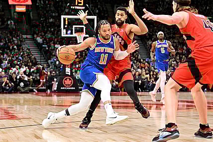 Mar 27, 2024; Toronto, Ontario, CAN;   New York Knicks guard Jalen Brunson (11) dribbles the ball against Toronto Raptors guard Garrett Temple (17) in the first half at Scotiabank Arena. Mandatory Credit: Dan Hamilton-USA TODAY Sports