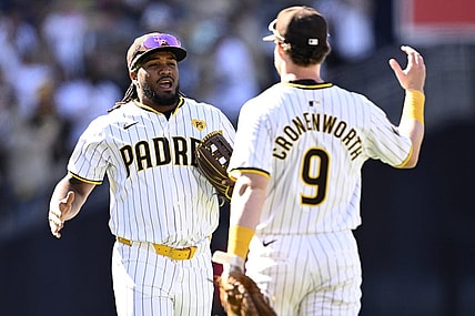 Mar 28, 2024; San Diego, California, USA; San Diego Padres third baseman Eguy Rosario (5) and first baseman Jake Cronenworth (9) celebrate on the field after defeating the San Francisco Giants at Petco Park. Mandatory Credit: Orlando Ramirez-USA TODAY Sports
