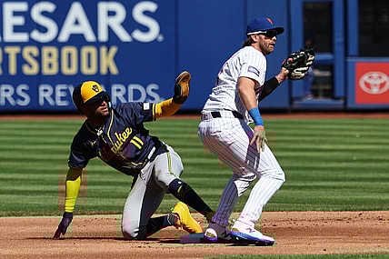 Mar 29, 2024; New York City, New York, USA; Milwaukee Brewers right fielder Jackson Chourio (11) calls for time after stealing second base behind New York Mets second baseman Jeff McNeil (1) before the game at Citi Field. Mandatory Credit: Vincent Carchietta-USA TODAY Sports