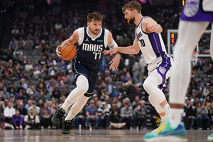Mar 29, 2024; Sacramento, California, USA; Dallas Mavericks guard Luka Doncic (77) dribbles next to Sacramento Kings forward Domantas Sabonis (10) in the first quarter at the Golden 1 Center. Mandatory Credit: Cary Edmondson-USA TODAY Sports
