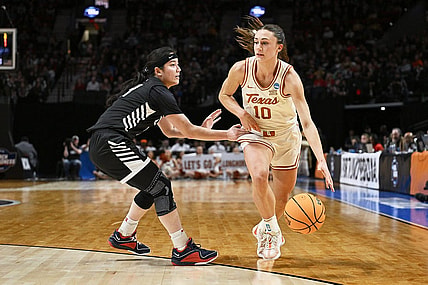 Mar 29, 2024; Portland, OR, USA; Texas Longhorns guard Shay Holle (10) dribbles the basketball during the first half against Gonzaga Bulldogs guard Kaylynne Truong (14) in the semifinals of the Portland Regional of the 2024 NCAA Tournament at the Moda Center at the Moda Center. Mandatory Credit: Troy Wayrynen-USA TODAY Sports