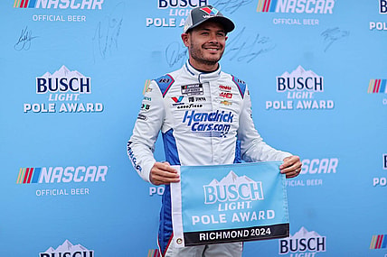 Mar 30, 2024; Richmond, Virginia, USA; NASCAR Cup Series driver Kyle Larson (5) celebrates within the pole after qualifying for the Toyota Owners 400 at Richmond Raceway. Mandatory Credit: Peter Casey-USA TODAY Sports