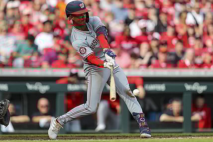 Mar 30, 2024; Cincinnati, Ohio, USA; Washington Nationals third baseman Trey Lipscomb (38) hits a single against the Cincinnati Reds in the third inning at Great American Ball Park. Mandatory Credit: Katie Stratman-USA TODAY Sports