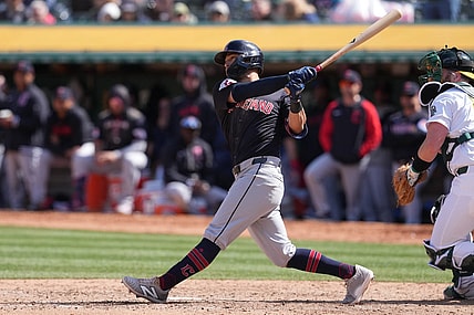 Mar 30, 2024; Oakland, California, USA; Cleveland Guardians center fielder Tyler Freeman (2) hits an RBI single against the Oakland Athletics during the sixth inning at Oakland-Alameda County Coliseum. Mandatory Credit: Darren Yamashita-USA TODAY Sports