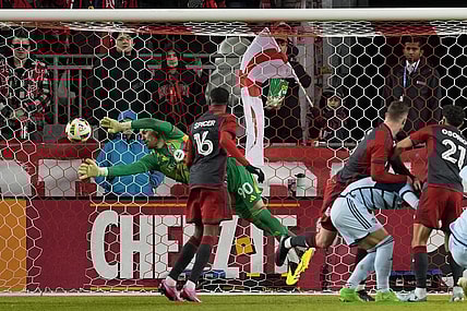 Mar 30, 2024; Toronto, Ontario, USA; Toronto FC goalkeeper Luka Gavran (90) dives to make a stop against Sporting Kansas City during the first half at BMO Field. Mandatory Credit: Nick Turchiaro-USA TODAY Sports