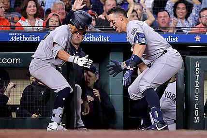 Mar 30, 2024; Houston, Texas, USA; New York Yankees third baseman Oswaldo Cabrera (95) celebrates with New York Yankees designated hitter Aaron Judge (99, right) after hitting a two-run home run to right field against the Houston Astros during the seventh inning at Minute Maid Park. Mandatory Credit: Erik Williams-USA TODAY Sports