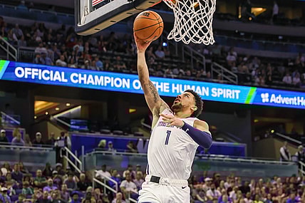 Mar 30, 2024; Orlando, Florida, USA; Memphis Grizzlies guard Scotty Pippen Jr. (1) goes to the basket during the second half against the Orlando Magic at KIA Center. Mandatory Credit: Mike Watters-USA TODAY Sports