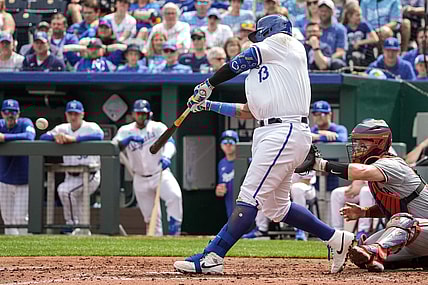 Mar 31, 2024; Kansas City, Missouri, USA; Kansas City Royals first baseman Salvador Perez (13) hits a one RBI single against the Minnesota Twins in the second inning at Kauffman Stadium. Mandatory Credit: Denny Medley-USA TODAY Sports