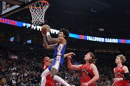 Mar 31, 2024; Toronto, Ontario, CAN; Philadelphia 76ers guard Kelly Oubre Jr. (9) drives to the basket over Toronto Raptors forward Kelly Olynyk (41) during the first quarter at Scotiabank Arena. Mandatory Credit: Nick Turchiaro-USA TODAY Sports