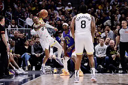 Mar 9, 2024; Denver, Colorado, USA; Utah Jazz guard Keyonte George (3) passes the ball to forward Brice Sensabaugh (8) as Denver Nuggets guard Kentavious Caldwell-Pope (5) defends in the third quarter at Ball Arena. Mandatory Credit: Isaiah J. Downing-USA TODAY Sports