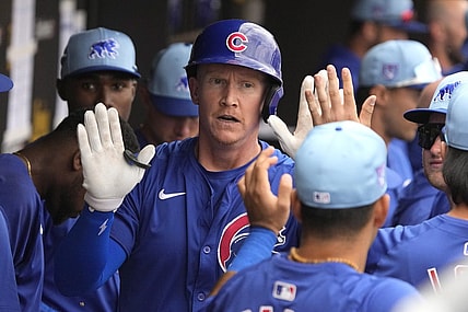 Mar 24, 2024; Peoria, Arizona, USA; Chicago Cubs left fielder Garrett Cooper (41) celebrates with teammates after hitting a home run against the Seattle Mariners in the third inning at Peoria Sports Complex. Mandatory Credit: Rick Scuteri-USA TODAY Sports