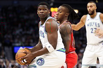 Mar 31, 2024; Minneapolis, Minnesota, USA; Minnesota Timberwolves guard Anthony Edwards (5) works around Chicago Bulls guard Ayo Dosunmu (12) during the first half at Target Center. Mandatory Credit: Matt Krohn-USA TODAY Sports