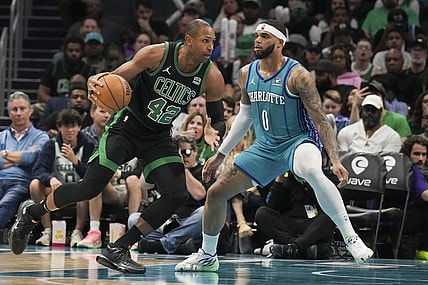 Apr 1, 2024; Charlotte, North Carolina, USA; Boston Celtics center Al Horford (42) drives against Charlotte Hornets forward Miles Bridges (0) during the second half at Spectrum Center. Mandatory Credit: Jim Dedmon-USA TODAY Sports