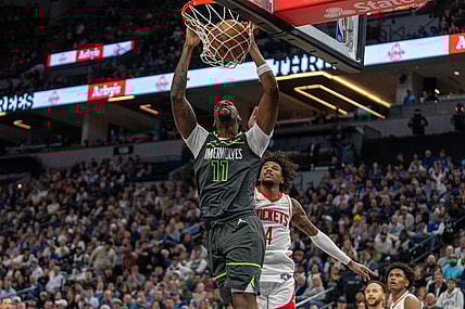Apr 2, 2024; Minneapolis, Minnesota, USA; Minnesota Timberwolves center Naz Reid (11) dunks over Houston Rockets guard Jalen Green (4) in the second quarter at Target Center. Mandatory Credit: Matt Blewett-USA TODAY Sports