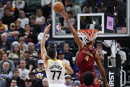 Apr 2, 2024; Salt Lake City, Utah, USA; Cleveland Cavaliers forward Evan Mobley (4) blocks the shot of Utah Jazz center Omer Yurtseven (77) during the second quarter at Delta Center. Mandatory Credit: Rob Gray-USA TODAY Sports