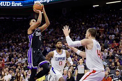 Apr 2, 2024; Sacramento, California, USA; Sacramento Kings forward Keegan Murray (13) shoots the ball over LA Clippers center Ivica Zubac (40) during the second quarter at Golden 1 Center. Mandatory Credit: Sergio Estrada-USA TODAY Sports
