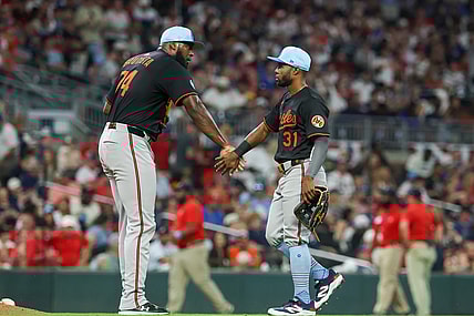 Baltimore Orioles players Felix Bautista and Cedric Mullins