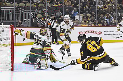 PITTSBURGH, PA - MARCH 11: Pittsburgh Penguins center Sidney Crosby (87) scores a goal against Vegas Golden Knights goaltender Ilya Samsonov (35) during the first period in the NHL game between the Pittsburgh Penguins and the Vegas Golden Knights on March 11, 2025, at PPG Paints Arena in Pittsburgh, PA. (Photo by Jeanine Leech/Icon Sportswire)
